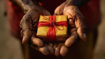 A fathers hands holding a gift box anticipation and excitement evident in his expression photo