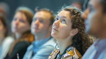Attendees eagerly take notes and ask questions during a workshop eagerly absorbing new knowledge and strategies for their research photo