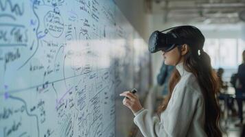 A shot of a student in a VR lab standing in front of a virtual whiteboard and using digital markers to write out equations and diagrams. This showcases the potential for collaboratio photo