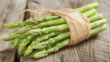 A closeup of a bundle of green asparagus spears with their tender tips and crisp stems signaling the arrival of spring photo