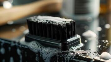 A detailed shot of the shavers cleaning brush used to remove excess hair and keep the blades sharp photo