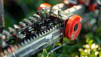 Closeup of the intricate and precise ting mechanism of an electric hedge trimmer photo