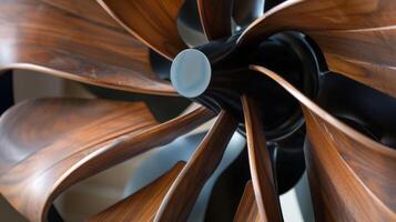 A closeup of the unique asymmetrical shape of the fans blades giving it a modern look photo