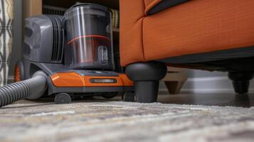 A closeup of the vacuum cleaners cord management system shows neatly coiled cords and a plug making it easy to maneuver around the room photo