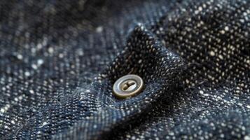 A closeup of the reverse stitch button used to reinforce the beginning and end of seams photo