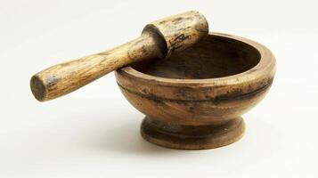 A small wooden mortar and pestle used by traditional Chinese medicine practitioners to grind herbs and create customized herbal blends for their patients photo