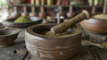 A closeup of a mortar and pestle used by traditional medicine practitioners to grind and mix different herbs and ingredients into powders and ointments photo