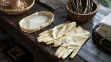 A set of thick rubberized gloves worn by the practitioner to protect their hands during the application of hot cups photo
