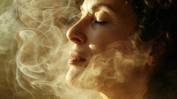 A womans face with closed eyes deeply inhaling and exhaling during a meditation session photo