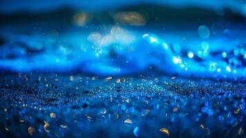 The sandy ocean floor is illuminated by the bioluminescent waves revealing hidden sea creatures and plant life photo