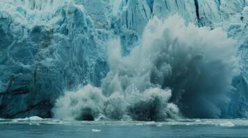 The sound of crackling ice echoes through the air as a massive chunk breaks off the glacier and plunges into the ocean photo