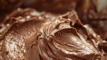 A detailed view of a plate with rich chocolate frosting spread evenly, creating a glossy and indulgent dessert photo