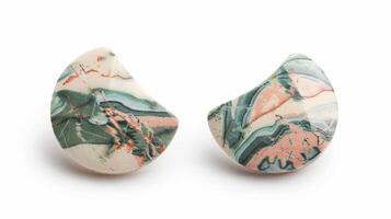 Blank mockup of a pair of stud earrings with a unique shape and a marblelike pattern photo