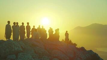 With the sun shining behind them a group of deities gather on the summit of Olympus faces hidden as they discuss matters of . photo