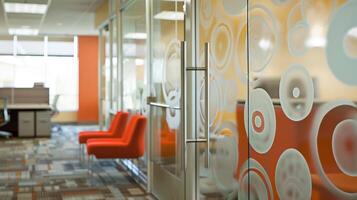 Creativity and privacy are combined in the designated quiet room where frosted glass partitions are adorned with inspirational quotes and designs. The frosted glass allows for a peaceful photo