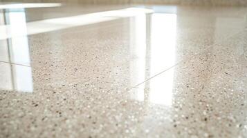 A closeup shot showcasing the smooth glossy finish of the terrazzo flooring indicating its ability to withstand regular foot traffic without any signs of wear or tear. photo