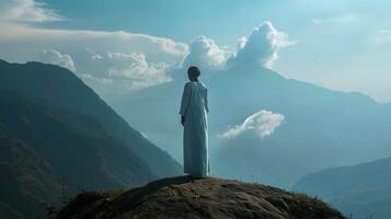 A midwife stands on a mountaintop a symbol of her unwavering strength and courage in the face of the challenging and emotionally demanding duties she fulfills as she supports women photo