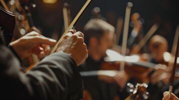 The delicate waves of a conductors hands guide an orchestra displaying a choreography of music and movement. photo