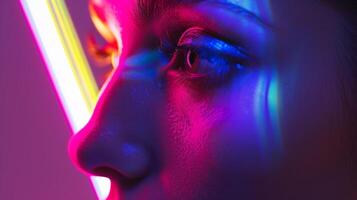 The soft glow of a neon sign creates a colorchanging effect on the skin casting shadows in unexpected hues. photo