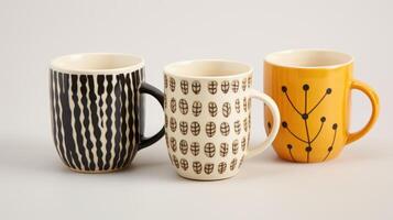 A set of ceramic mugs, each with their own quirks and handpainted patterns, making morning coffee just a little more special. photo