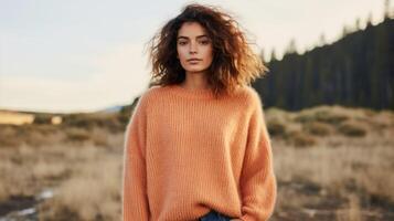 Minimalistic view of a cozy Peach Fuzz sweater, made from repurposed cashmere and wool. The oversized fit and chunky knit create the ultimate in comfort and style. photo