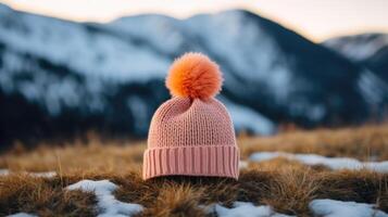Minimalistic view of a knitted Peach Fuzz beanie, adorned with a playful pom pom and ready to tackle any winter adventure. photo