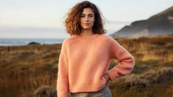 Minimalistic view of a Peach Fuzz knit sweater, handcrafted from repurposed wool. Cozy, comfortable, and environmentally responsible. photo