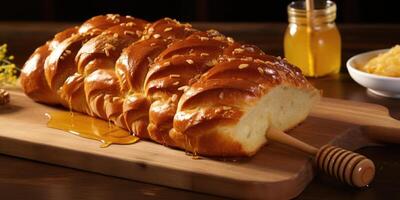 The slightly sweet taste of the Challah bread is enhanced by a touch of honey, complementing its mellow wheatiness with a gentle hint of caramel. photo