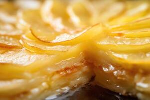 An appealing closeup photograph capturing a slice of apple pie, allowing the viewer to admire the layers of thinly sliced apples intertwined with a hint of tartness from freshly squeezed photo