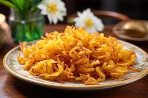 Are they flowers or a culinary masterpiece This plate of fried onion blossoms teases you with their visually arresting presentation, while their tastes leave you longing for another petal photo