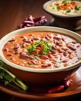 A colorful plate of lobio, a thick and creamy bean stew, adorned with vibrant red beans that have been simmered with onions, garlic, and a blend of es, creating a comforting and flavorful photo