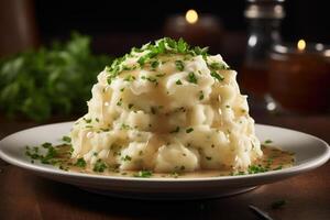 Whipped to perfection, a mountain of velvety mashed potatoes garnished with chopped parsley, and crowned with a generous drizzle of indulgent gravy that adds a burst of savory joy to this photo