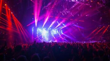The crowd becomes an active participant in the show moving and swaying to the music as the lights change and move around them photo