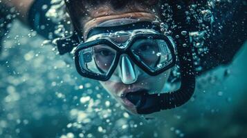 A closeup of a divers face as they gracefully twist and turn through the air photo