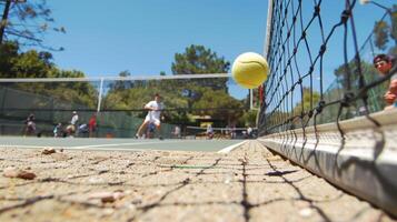 The satisfying moment when a players powerful volley hits the ground on their opponents side captured in a closeup shot photo