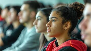 Aspiring athletes attend lectures and workshops at the sports academy learning about the importance of sportsmanship and teamwork in addition to athletic skills photo