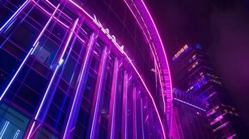 Neon lights illuminate the exterior of this vertical stadium making it a vibrant and eyecatching addition to the urban landscape photo