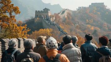 A group of people stand in awe backs turned to the camera as they gaze up at the towering walls and majestic architecture of . photo