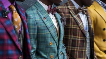 A group of black men dressed in suits of different colors and patterns stand together showcasing the diversity and individuality within dandyism. Representing a movement that challenges photo