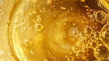 A magnified view of the inside of one of the containers revealing a smooth golden liquid with tiny bubbles floating to the surface. photo