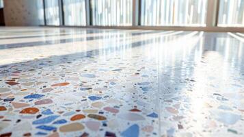 As the sunlight streams in through the windows it dances off the terrazzo floor highlighting the unique and dynamic speckled pattern. It is a visual representation of sustainability photo