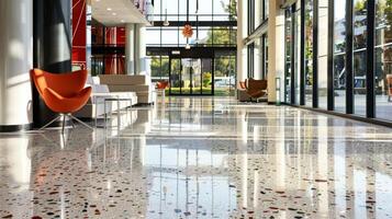 A smooth and glossy terrazzo surface reflects the natural lighting of the room showcasing its vibrant and diverse composition of recycled materials. With each step one can feel the photo