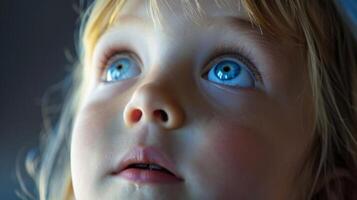 A child eagerly watching a silent speaker with wideeyed curiosity and wonder representing the impact and influence that these interpreters have on those around them. photo