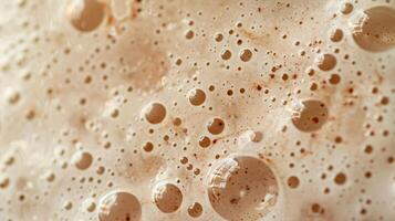 A galaxy of freckles and moles speckled across a field of warm beige tones each one a unique and beautiful blemish. photo