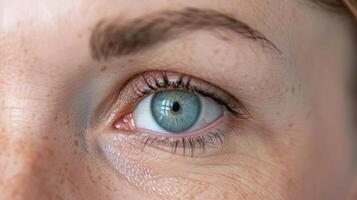 Faint wrinkles appear between the eyebrows conveying a sense of concentration and focus. photo