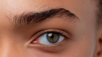 One brow is raised slightly higher than the other creating a quizzical and playful expression. photo