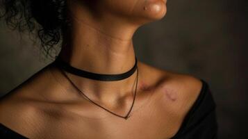 The scars on a womans neck where a choker necklace once rested symbolize the freedom and liberation she has found in being true to herself. photo