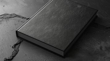 Blank mockup of a book cover with a sleek and modern design utilizing metallic foil and embossed lettering for added texture photo
