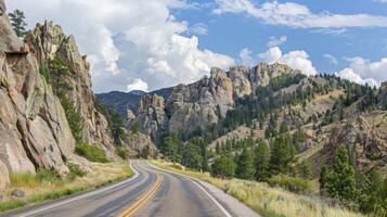 The highway s through a rugged mountain landscape with rocky cliffs and jagged peaks rising up on either side. . AI generation photo