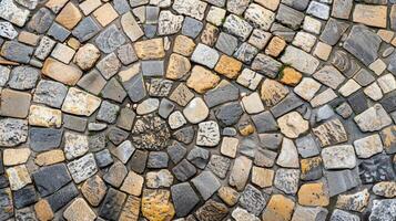 An intricate mosaic pattern of grey and tan cobblestones creates a pathway through a charming cobblestone village. . AI generation photo